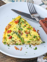 Asparagus Frittata on plate with fork and knife