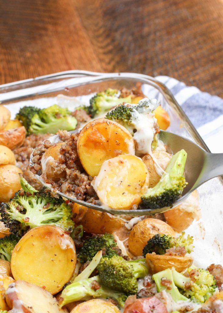 Cheesy crisp roasted potatoes with sausage and broccoli