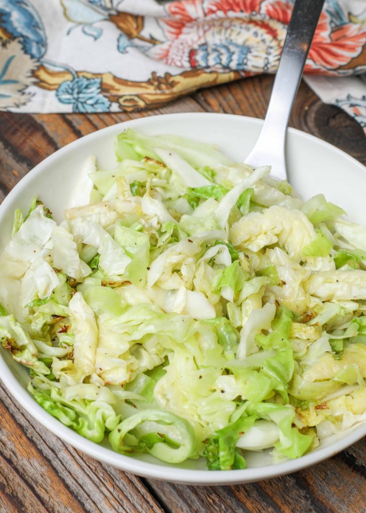 Cabbage in serving dish with spoon