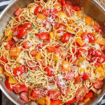 angel hair with peppers and tomatoes in large skillet