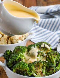 cheddar cheese sauce poured on broccoli