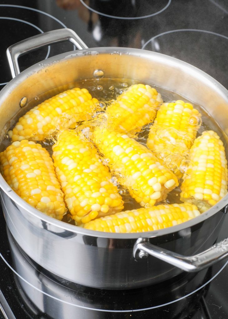 Corn boiling in pot