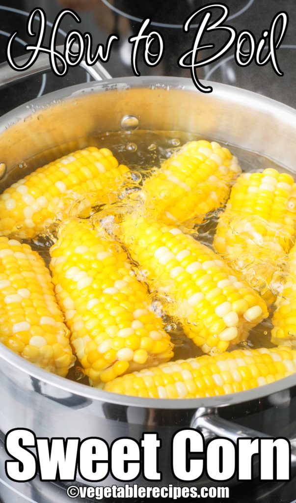 Boiling water with corn in pot