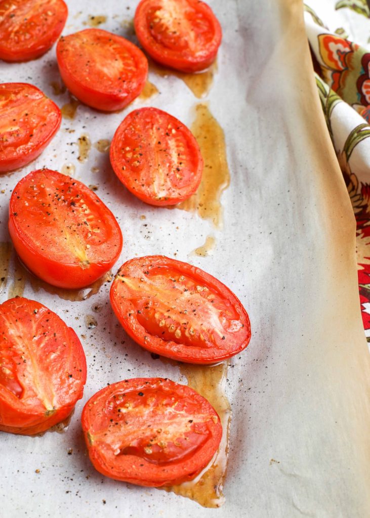 juicy tomatoes roasted on baking sheet