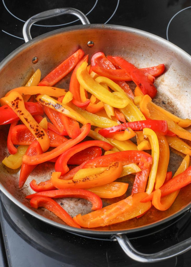 Red and Yellow Peppers in skillet