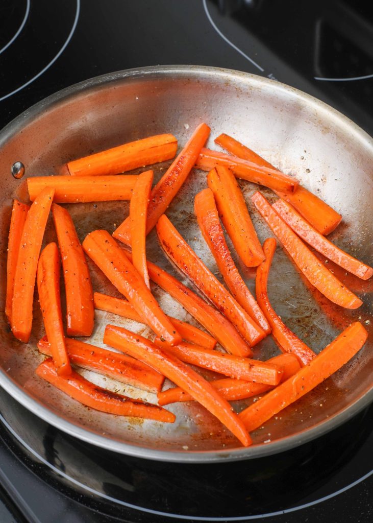 carrots sauteeing in pan