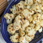 Cooked cauliflower on blue plate