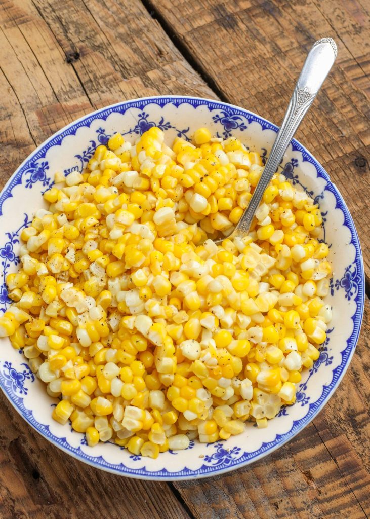 cooked corn in blue bowl