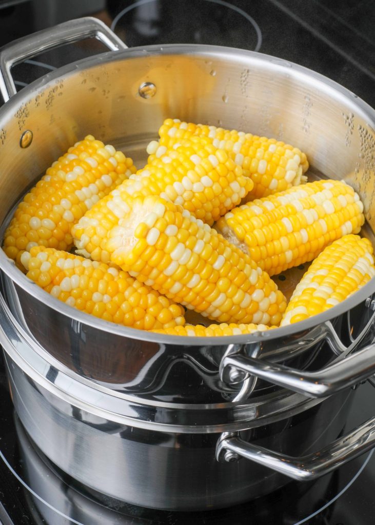 Steamer basket with corn 