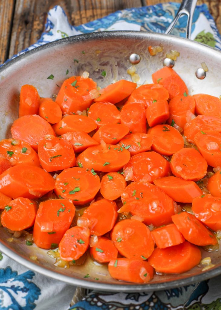 glazed carrots in stainless pan