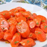 carrots on white plate with parsley