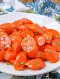 carrots on white plate with parsley
