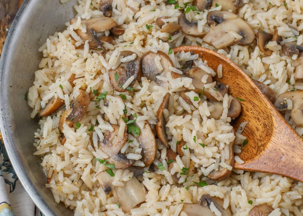 rice with mushrooms in stainless pan