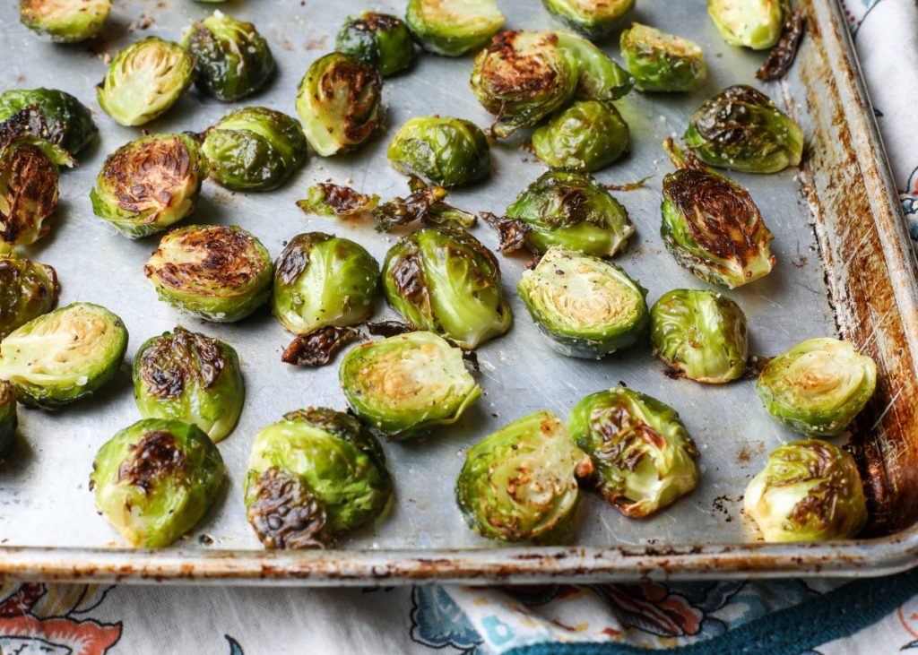 Cooked Brussels sprouts on large sheet pan