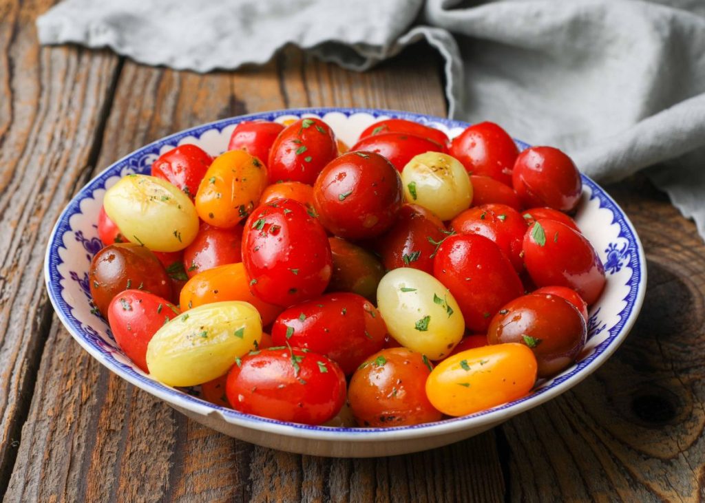Sauteed small tomatoes in bowl