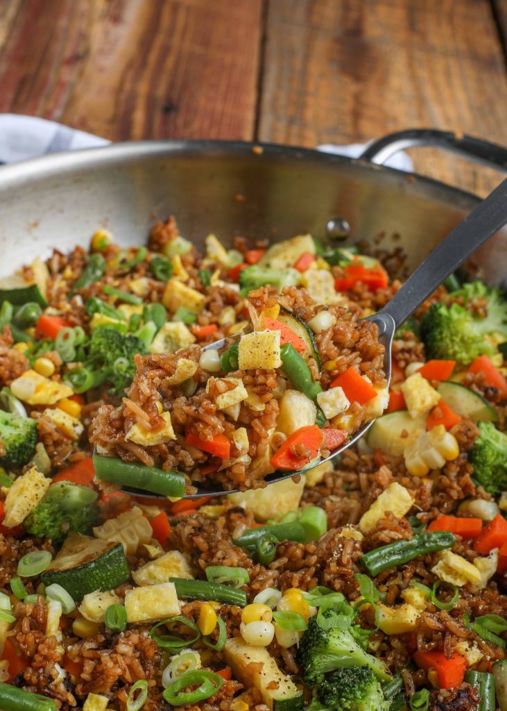 Fried Rice with lots of vegetables in stainless skillet