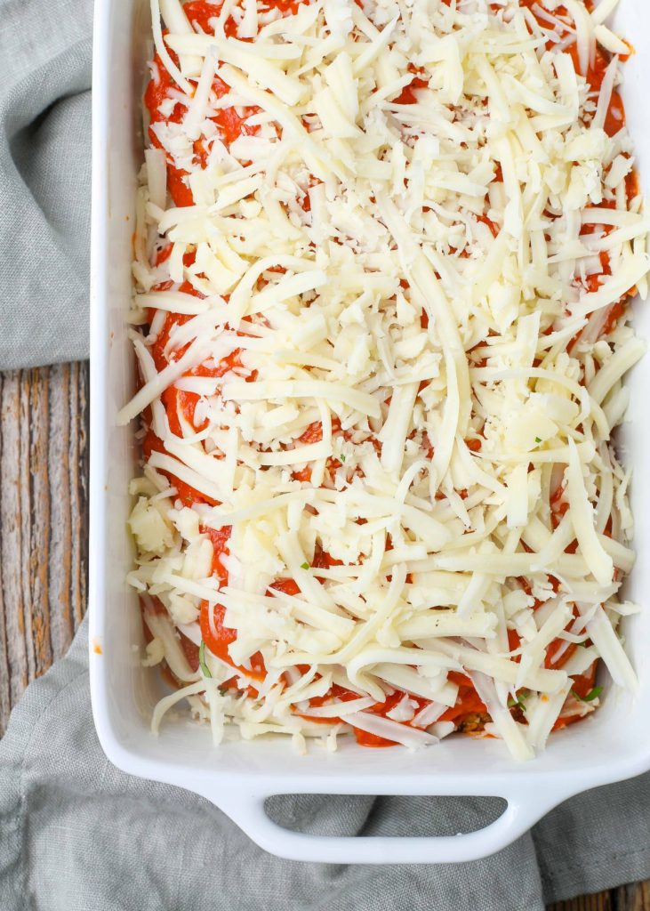 Cheesy Eggplant Parm in white baker