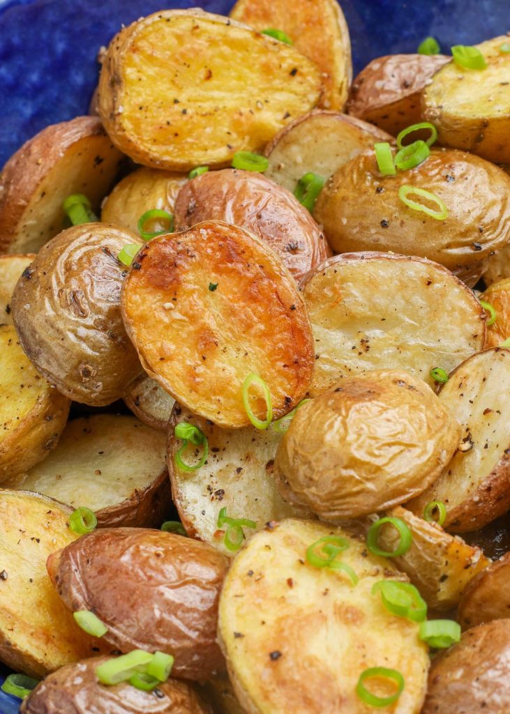 Crispy Oven Roasted Potatoes in blue bowl