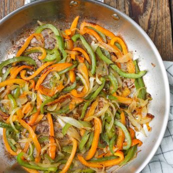 sauteed bell peppers and onions in skillet