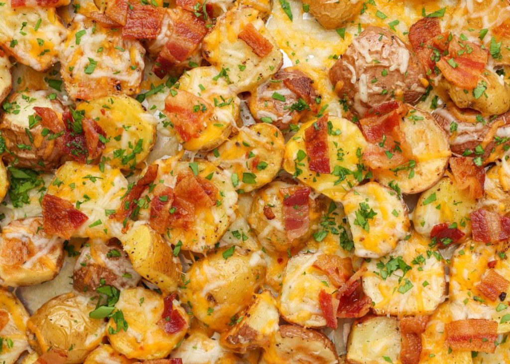 close up of roasted potatoes with bacon and cheese
