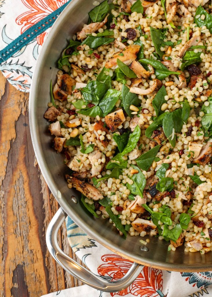 couscous and spinach in skillet