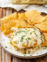 Spinach Enchiladas on plate with tortilla chips