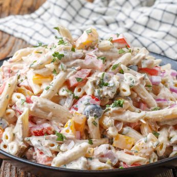 creamy pasta salad with tuna, olives, jalapenos, and bell peppers