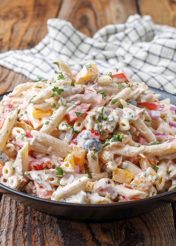 creamy pasta salad with tuna, olives, jalapenos, and bell peppers