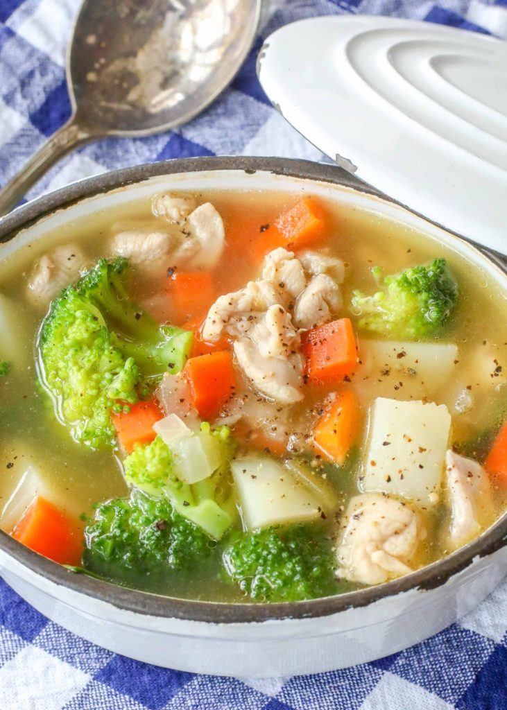 Vegetable Soup with Chicken in white crock with lid