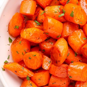 bite-size roasted carrots in white bowl