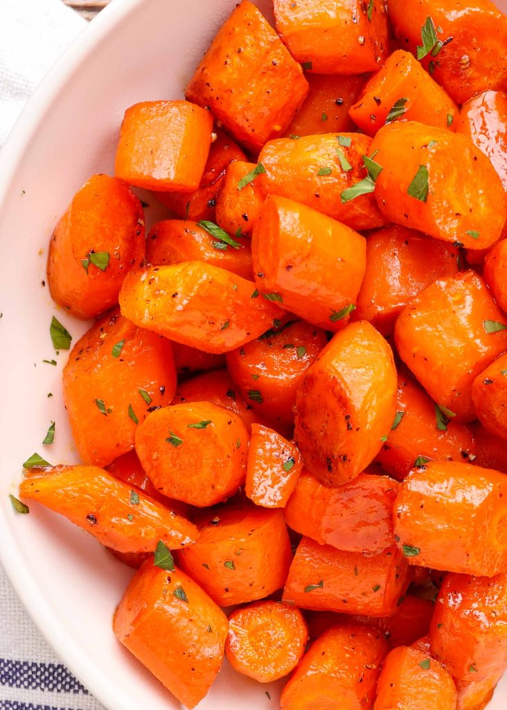 bite-size roasted carrots in white bowl