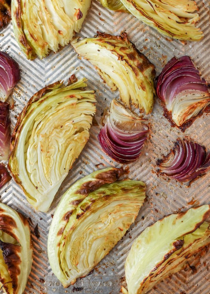 Cabbage with Red Onions roasted on baking sheet