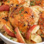 red potato wedges with chicken in round bowl