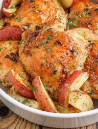 red potato wedges with chicken in round bowl