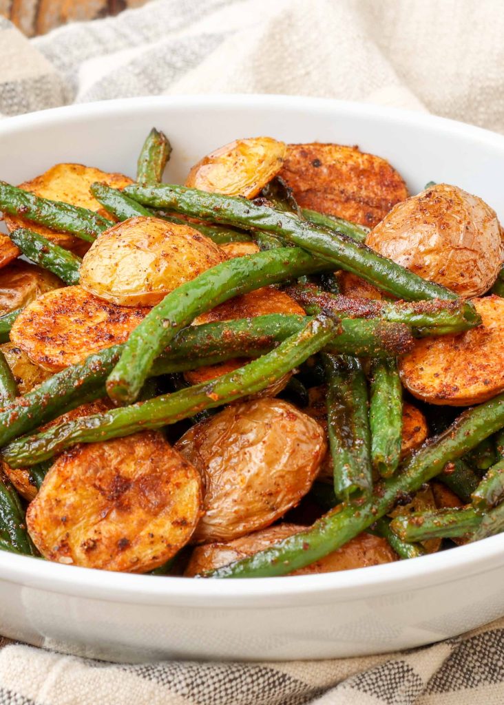 green beans and potatoes in white dish