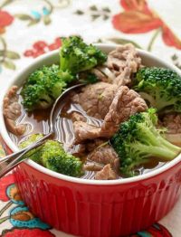 broccoli beef soup in red bowl