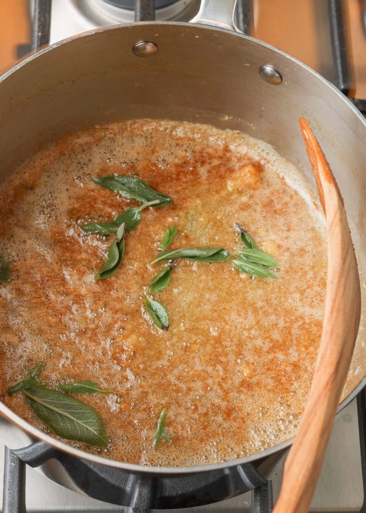 browned butter in saucepan with sage