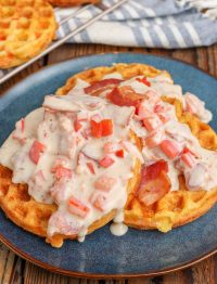 waffles with bacon gravy on blue plate