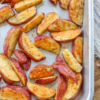 Seasoned Roasted Red potatoes on Sheet Pan.