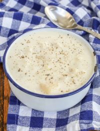creamy potato soup in enamel bowl with spoon
