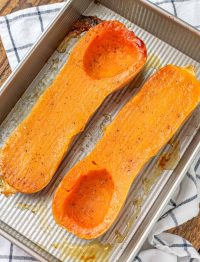 roasted butternut squash with oil salt and pepper in pan