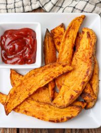 Air Fryer Sweet Potato Wedges white plate with ketchup