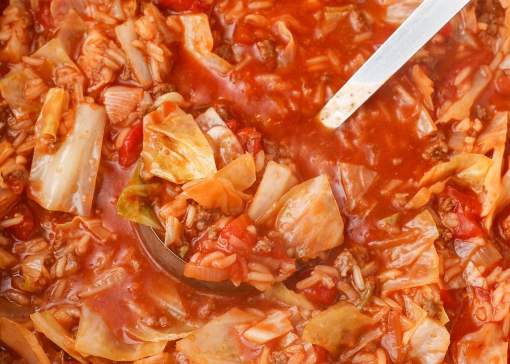 Ground Beef Cabbage Roll Soup in a metal ladle