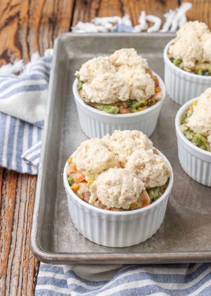 Mini Chicken Pot Pie uncooked with drop biscuits on baking sheet
