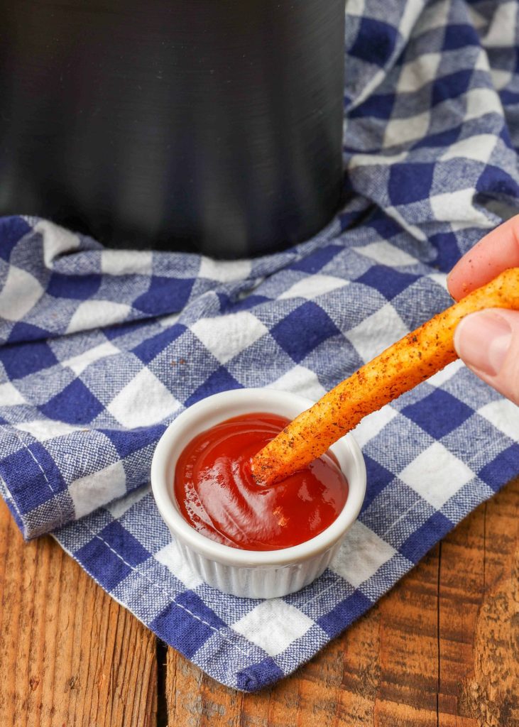 seasoned french fry with ketchup