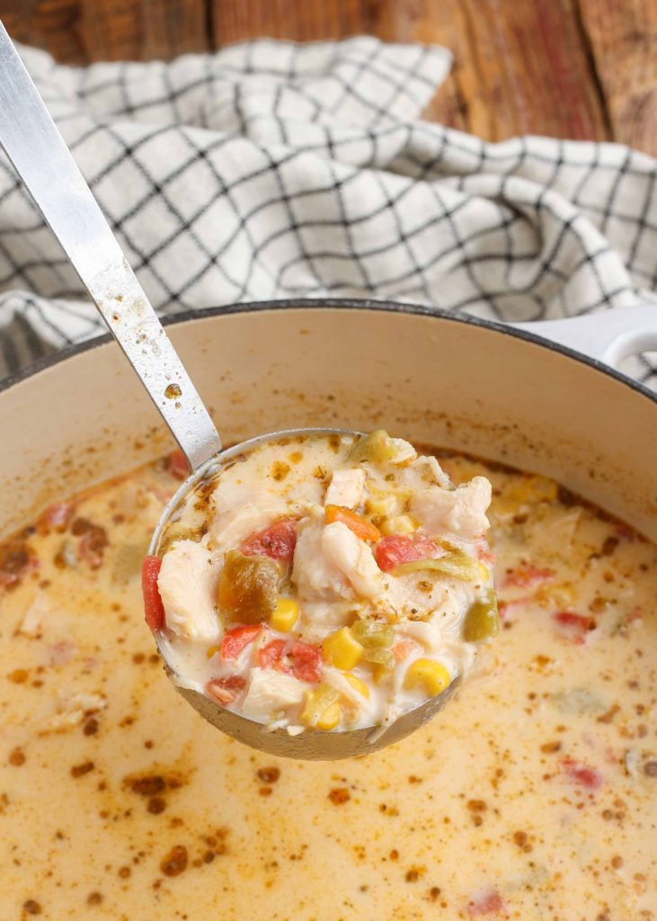 Creamy Chicken Corn Soup in Dutch oven with ladle