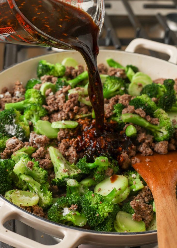 Ground Beef Broccoli Stir Fry sauce pouring in 