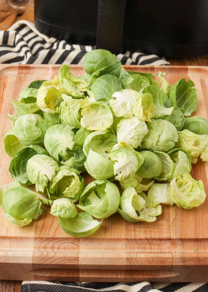 Air Fryer Brussels Sprouts Chips pile of leaves on cutting board