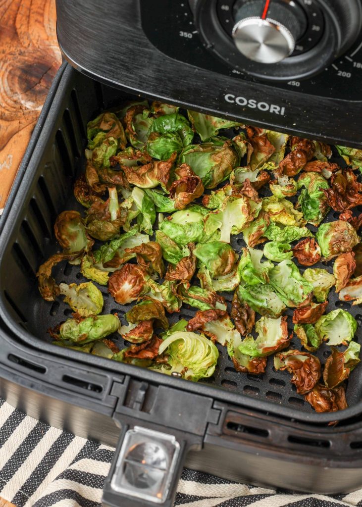 Air Fryer Brussels Sprouts Chips in fryer basket