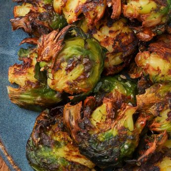 Air Fryer Smashed Brussels Sprouts on blue plate